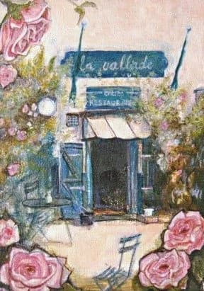 Een schilderachtig restaurant gelegen in een tuin, omringd door roze en paarse bloemen, met een blauw en wit terras en een bord met de naam 'La Vallée'